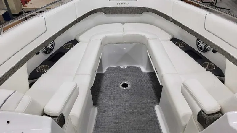 Slide: The Image of 2025 Formula 290 Bowrider interior with white seating and modern design. - 17