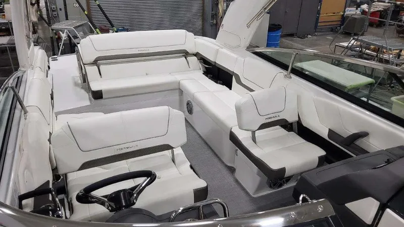 Slide: The Image of 2025 Formula 290 Bowrider interior with luxurious white seating and modern design. - 19