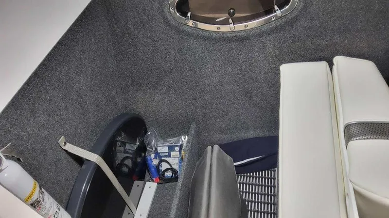 Slide: The Image of Interior of 2025 Formula 290 Bowrider boat with storage and seating area. - 20