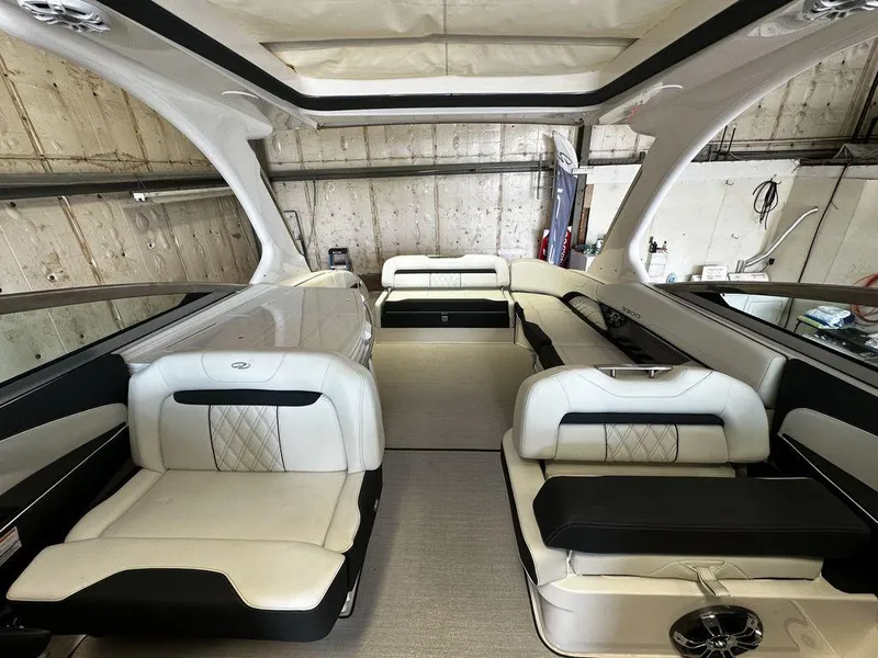 Slide: The Image of Interior of a 2025 Regal 3300 boat with luxurious white seating. - 10