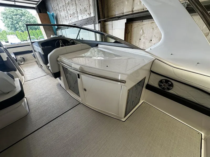 Slide: The Image of 2025 Regal 3300 boat interior with seating and storage compartments. - 14