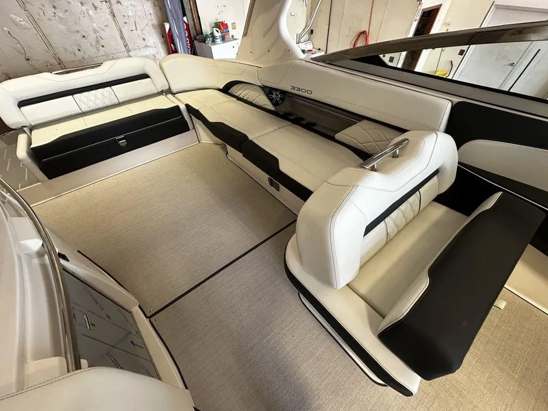 Slide: The Image of Interior of a 2025 Regal 3300 boat with luxurious seating. - 16