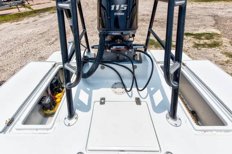 Slide: The Image of 1996 Hewes Tunnel boat with Yamaha 115 engine, rear deck view. - 14