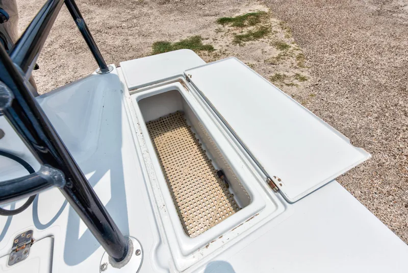 Slide: The Image of Open storage compartment on a 1996 Hewes Tunnel boat. - 16