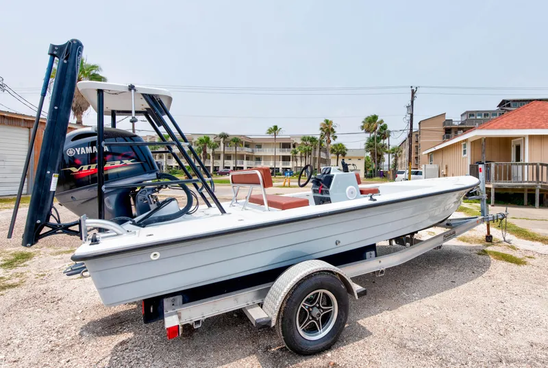 Slide: The Image of 1996 Hewes Tunnel boat on a trailer with Yamaha outboard motor. - 2
