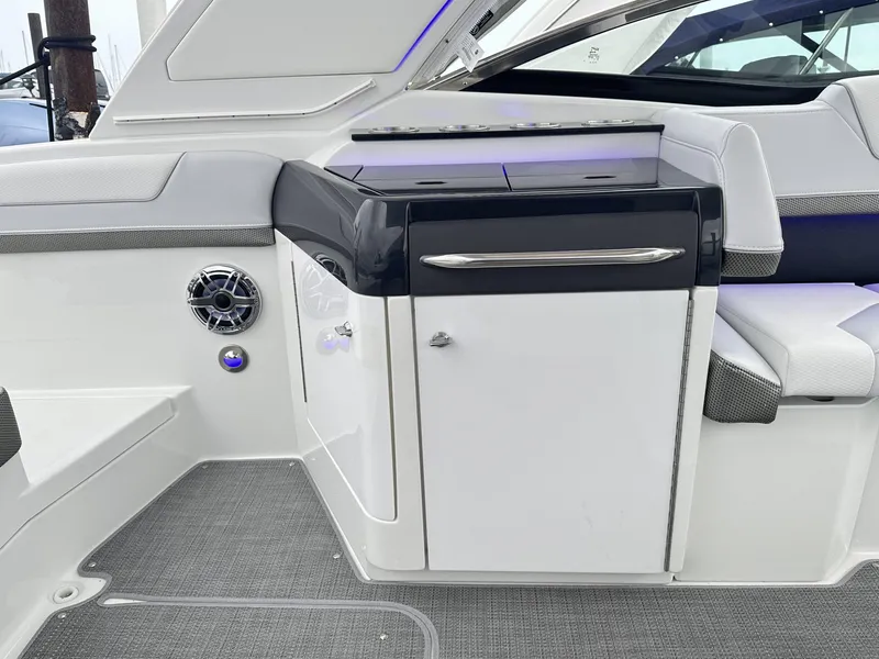 Slide: The Image of 2024 Formula 310 Bowrider I/O interior, featuring sleek cabinetry and modern design. - 14