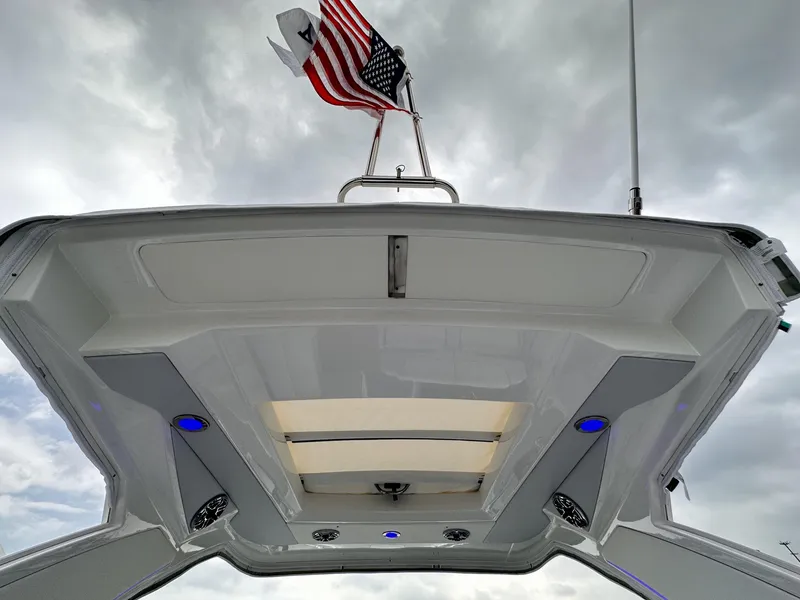 Slide: The Image of 2024 Formula 310 Bowrider I/O boat with American flag, viewed from below. - 3