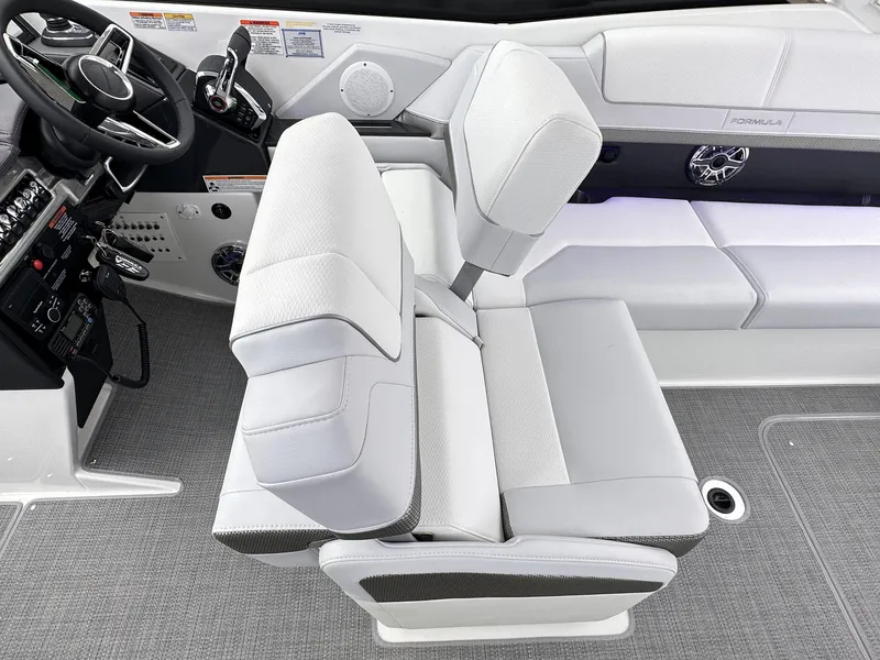 Slide: The Image of 2024 Formula 310 Bowrider I/O interior with white and gray seating. - 30