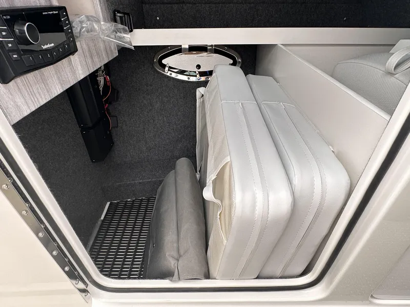 Slide: The Image of 2024 Formula 310 Bowrider I/O interior storage compartment with folded seats. - 41