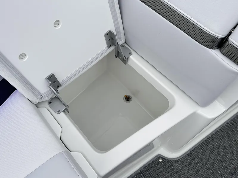 Slide: The Image of 2024 Formula 310 Bowrider I/O storage compartment with open lid. - 49