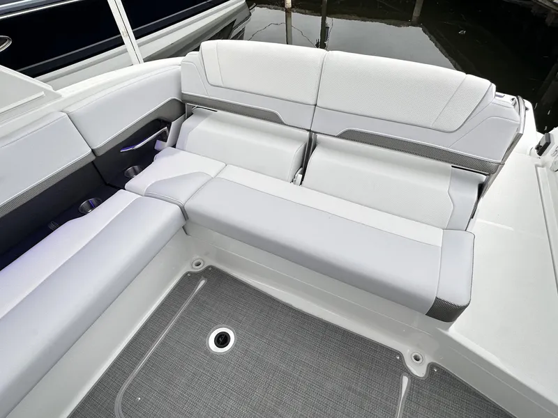 Slide: The Image of 2024 Formula 310 Bowrider I/O, spacious rear seating area with modern upholstery. - 9