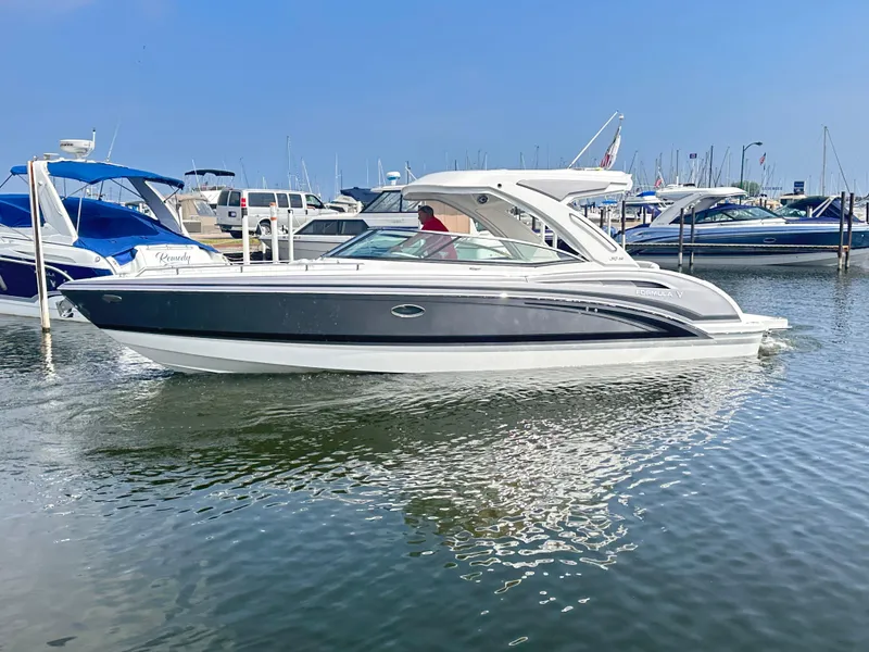 The Image of 2024 Formula 310 Bowrider I/O boat docked in a marina. - 0