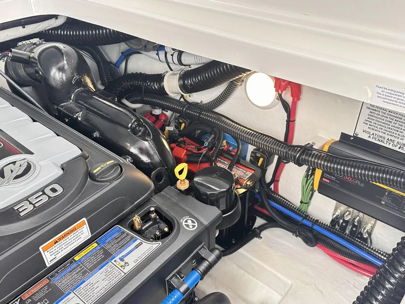 Slide: The Image of Engine compartment of a 2024 Formula 310 Bowrider I/O boat. - 12