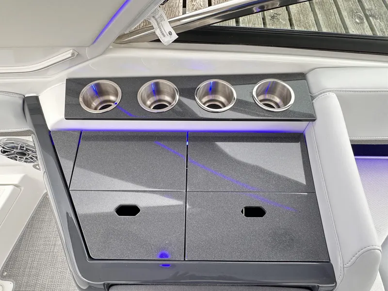 Slide: The Image of 2024 Formula 310 Bowrider I/O interior with cup holders and storage compartments. - 17