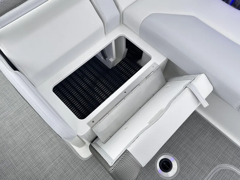 Slide: The Image of 2024 Formula 310 Bowrider I/O interior storage compartment with open seat cushion. - 27