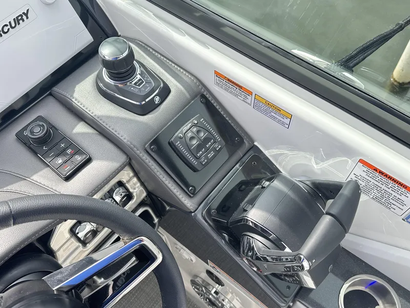 Slide: The Image of 2024 Formula 310 Bowrider I/O helm controls and dashboard. - 34