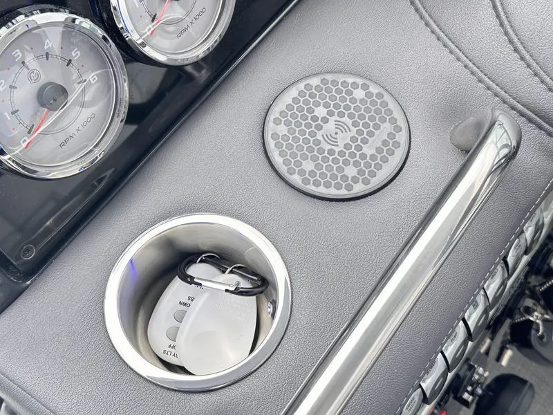 Slide: The Image of 2024 Formula 310 Bowrider I/O dashboard with cup holder and gauges. - 35