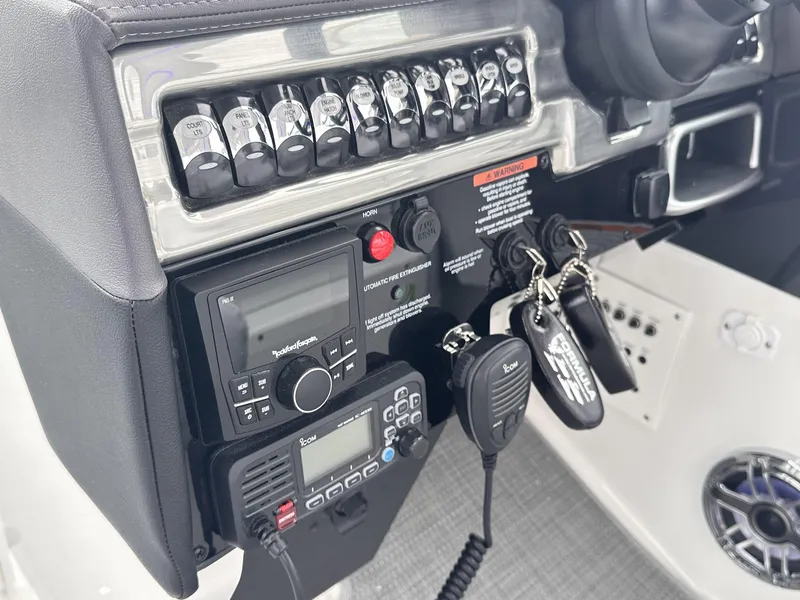 Slide: The Image of Control panel of 2024 Formula 310 Bowrider I/O with radio and keys. - 36