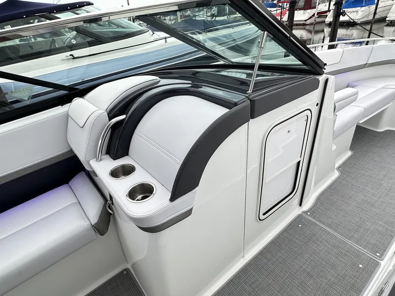 Slide: The Image of 2024 Formula 310 Bowrider I/O interior with seating and cup holders. - 37