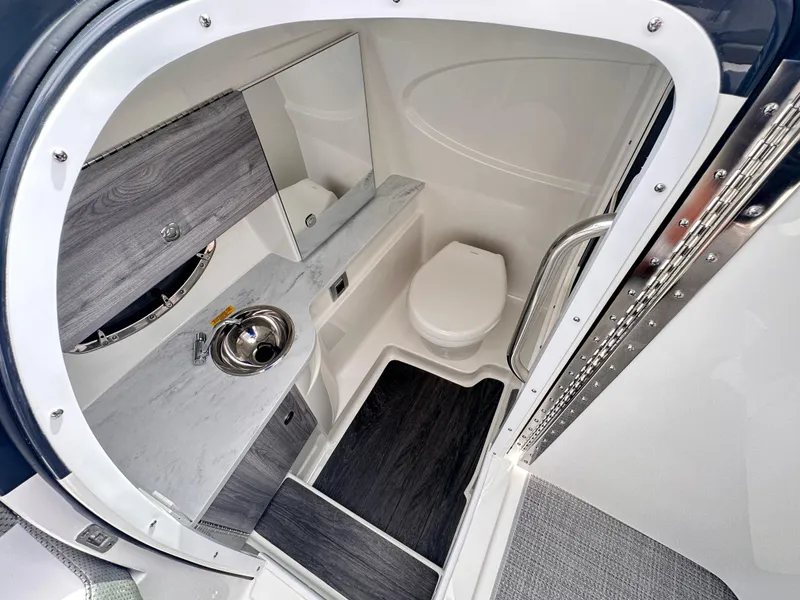 Slide: The Image of 2024 Formula 310 Bowrider I/O boat bathroom with modern sink and toilet. - 38