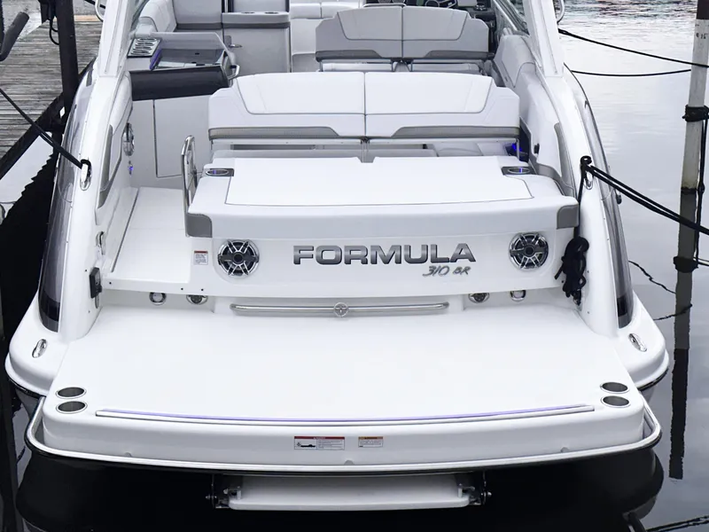 Slide: The Image of 2024 Formula 310 Bowrider I/O boat rear view at dock. - 4