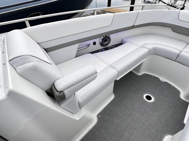 Slide: The Image of 2024 Formula 310 Bowrider I/O interior seating area with gray upholstery. - 46