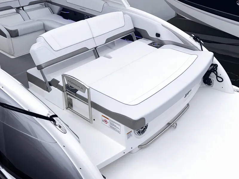 Slide: The Image of 2024 Formula 310 Bowrider I/O boat with spacious seating and sleek design. - 5