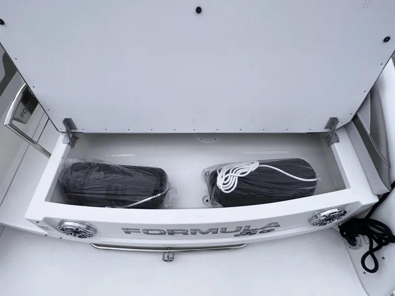 Slide: The Image of 2024 Formula 310 Bowrider I/O storage compartment with fenders. - 6