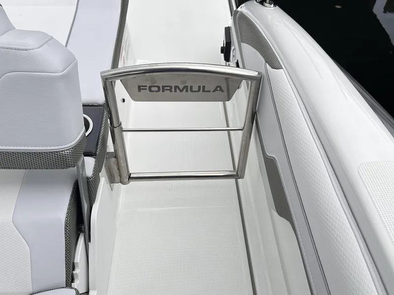 Slide: The Image of 2024 Formula 310 Bowrider I/O boat interior with branded gate. - 7