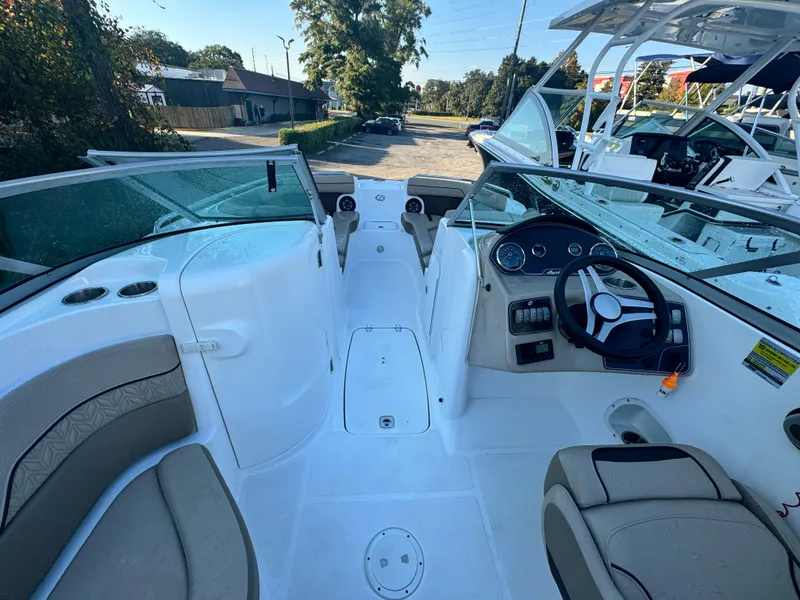 Slide: The Image of 2023 Hurricane SunDeck 2200 DC OB boat interior with seating and steering console. - 18