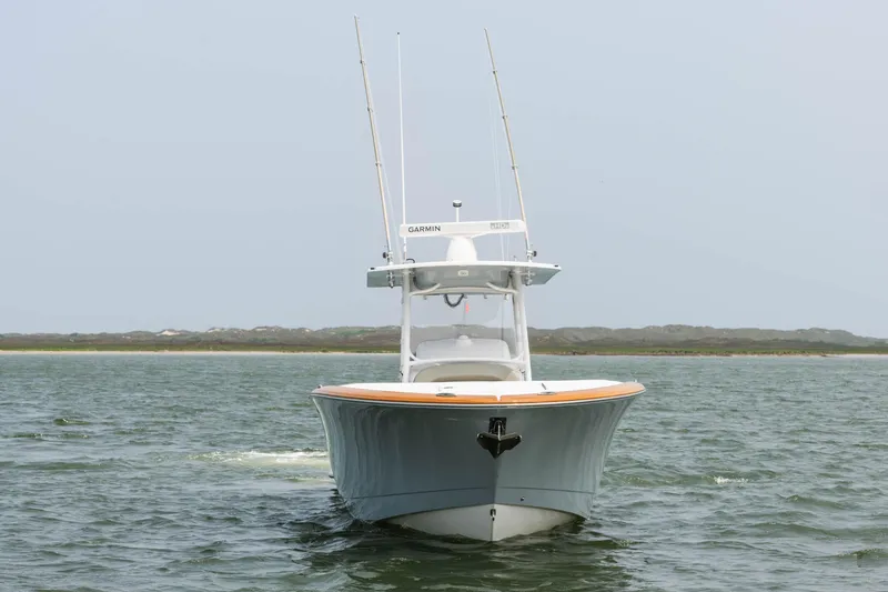 Slide: The Image of 2017 Mag Bay 33cc boat on water, front view. - 1