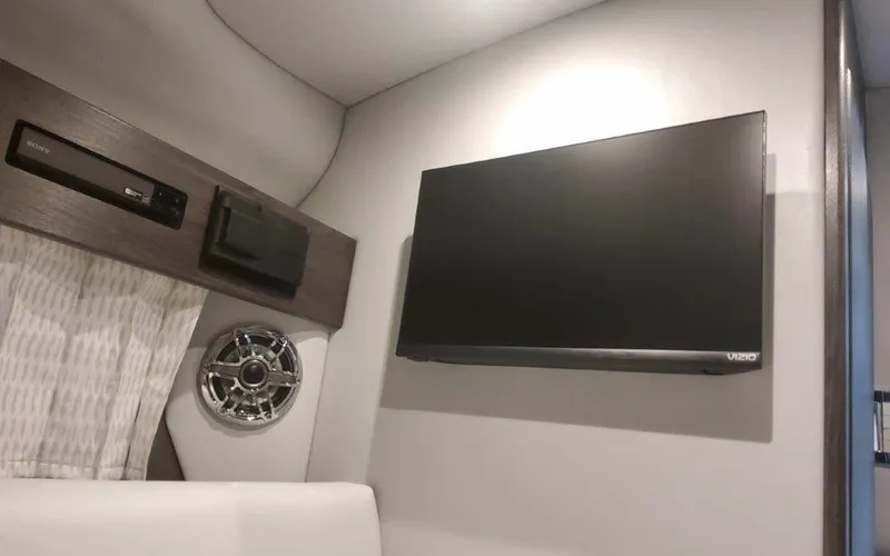 Slide: The Image of Interior of 2025 Formula 330 Crossover Bowrider I/O with TV and speaker system. - 13