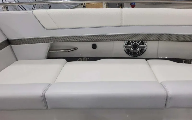 Slide: The Image of 2025 Formula 330 Crossover Bowrider I/O interior with white seating and speaker detail. - 30