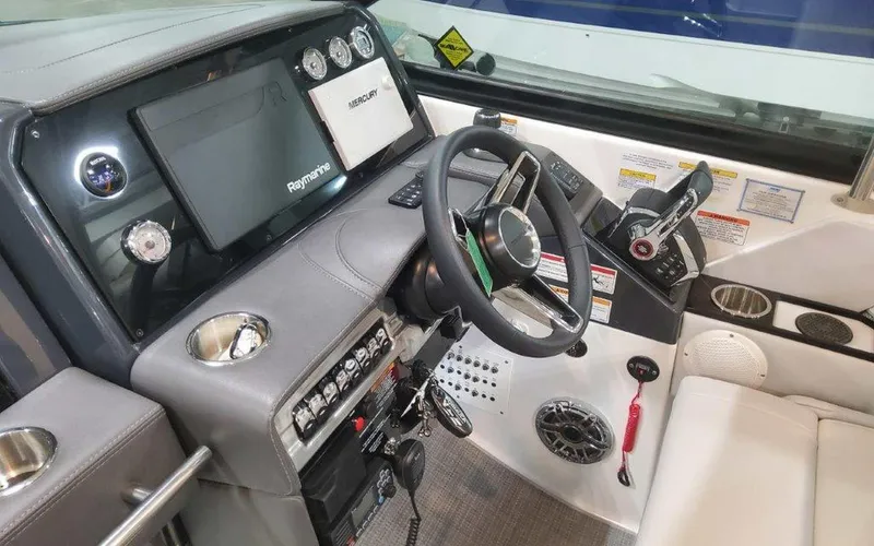 Slide: The Image of 2025 Formula 330 Crossover Bowrider I/O dashboard with steering wheel and control panel. - 41