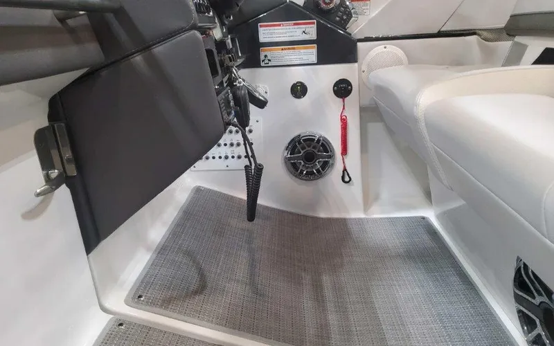 Slide: The Image of 2025 Formula 330 Crossover Bowrider I/O interior cockpit with controls and seating. - 42