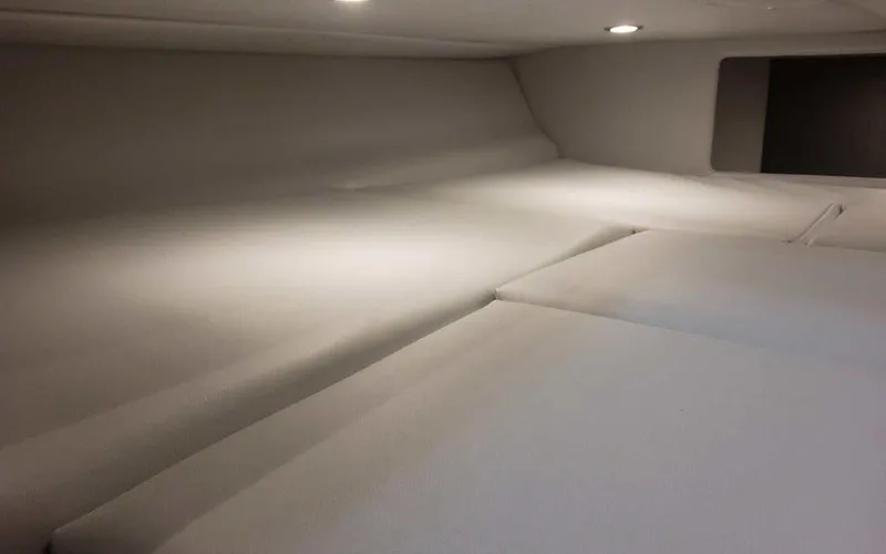 Slide: The Image of 2025 Formula 330 Crossover Bowrider I/O cabin interior with modern lighting. - 10