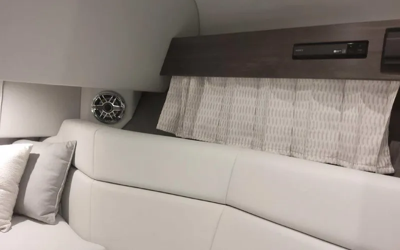 Slide: The Image of Interior of 2025 Formula 330 Crossover Bowrider I/O, featuring sleek seating and modern design. - 12