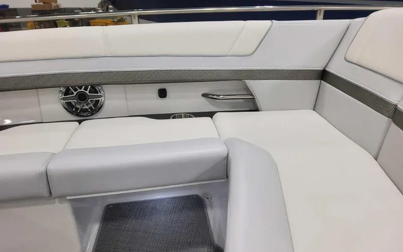 Slide: The Image of 2025 Formula 330 Crossover Bowrider I/O interior with white seating and sleek design. - 26