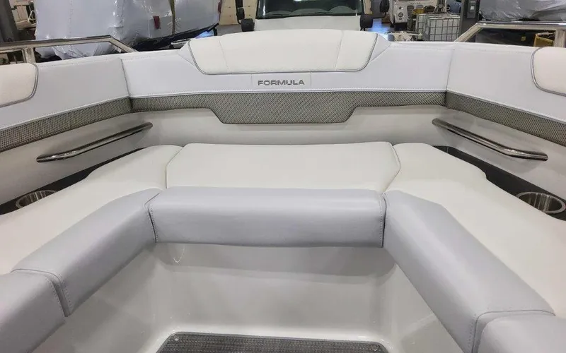 Slide: The Image of 2025 Formula 330 Crossover Bowrider I/O interior with white seating and sleek design. - 28