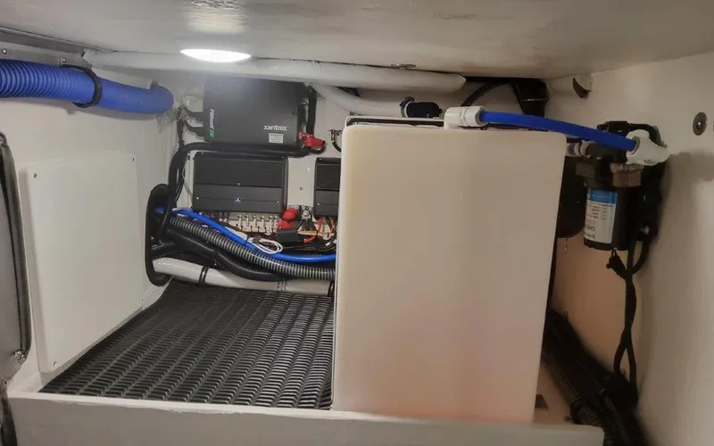 Slide: The Image of 2025 Formula 330 Crossover Bowrider I/O engine compartment with wiring and components. - 48