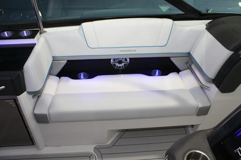 Slide: The Image of 2027 Formula 330 Crossover Bowrider I/O interior seating with cup holders and ambient lighting. - 25