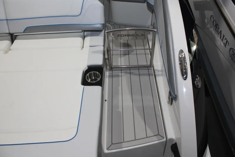 Slide: The Image of 2027 Formula 330 Crossover Bowrider I/O interior with seating and stainless steel details. - 14