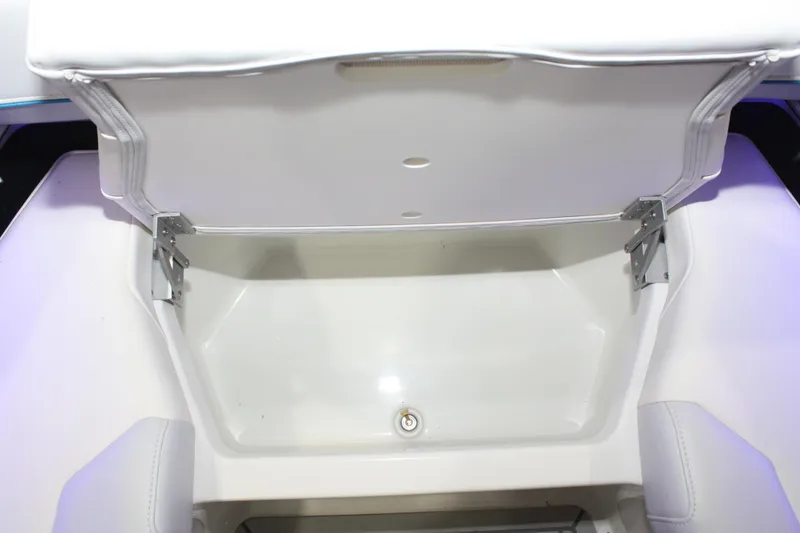 Slide: The Image of Open storage compartment in 2027 Formula 330 Crossover Bowrider I/O boat. - 48