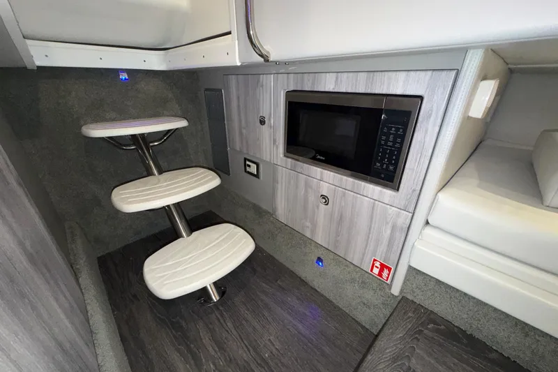 Slide: The Image of Interior of 2027 Formula 330 Crossover Bowrider I/O with modern amenities and sleek design. - 34