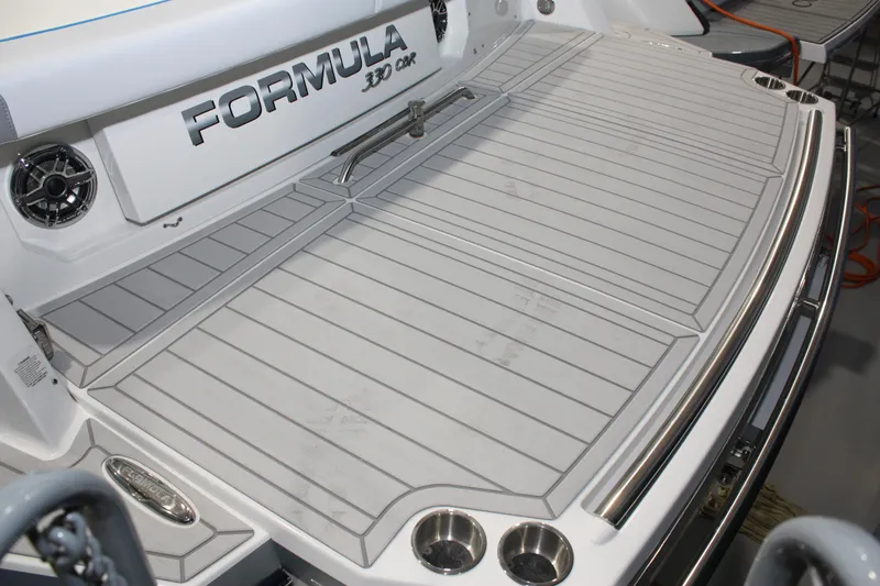 Slide: The Image of 2027 Formula 330 Crossover Bowrider I/O swim platform with speakers and cup holders. - 9