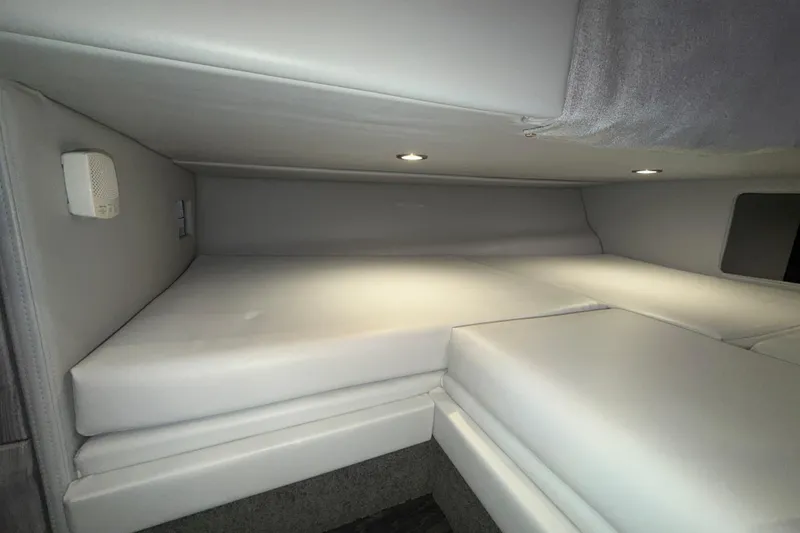 Slide: The Image of Interior cabin of 2027 Formula 330 Crossover Bowrider I/O, featuring cushioned seating and ambient lighting. - 35