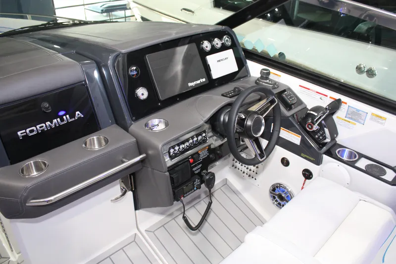 Slide: The Image of 2027 Formula 330 Crossover Bowrider I/O dashboard with advanced controls and navigation system. - 53