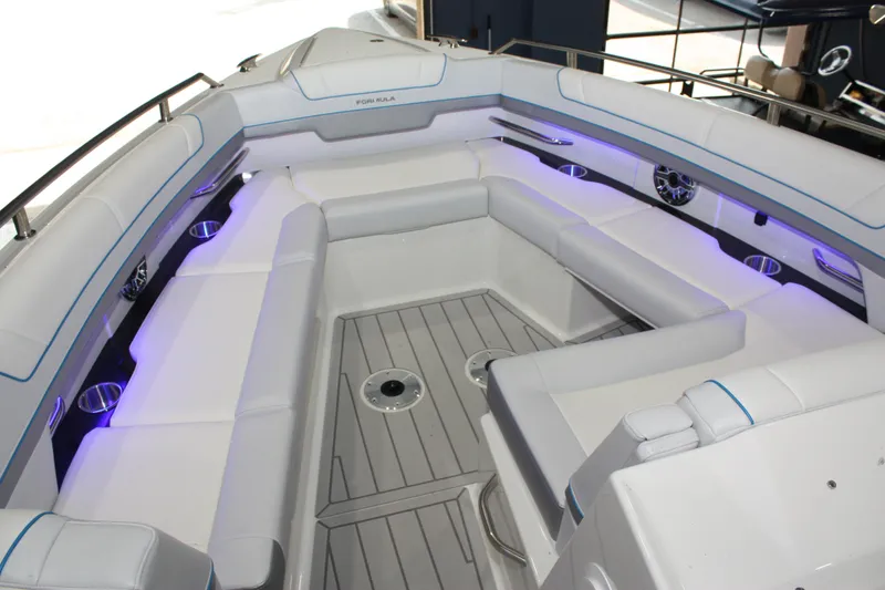 Slide: The Image of Luxurious seating area on 2027 Formula 330 Crossover Bowrider I/O boat with ambient lighting. - 44