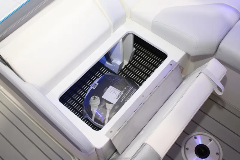 Slide: The Image of Storage compartment in 2027 Formula 330 Crossover Bowrider I/O boat with white seating. - 20