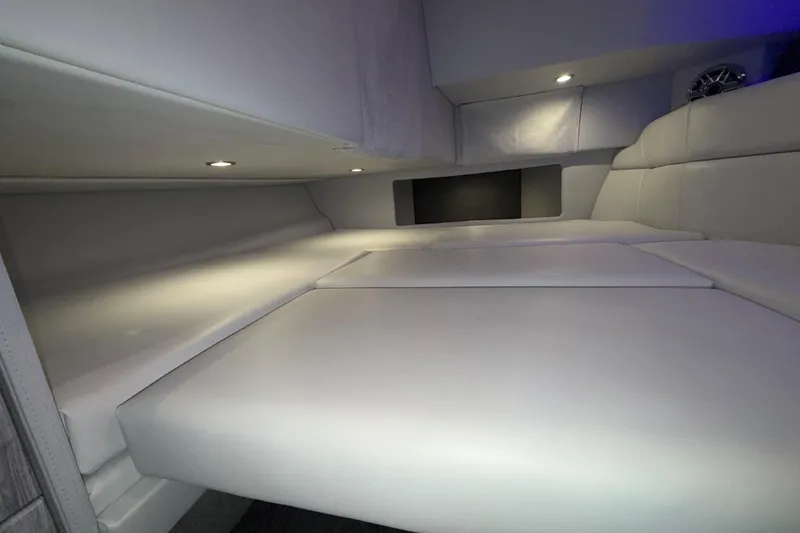 Slide: The Image of Interior cabin of 2027 Formula 330 Crossover Bowrider I/O, featuring sleek white seating. - 37